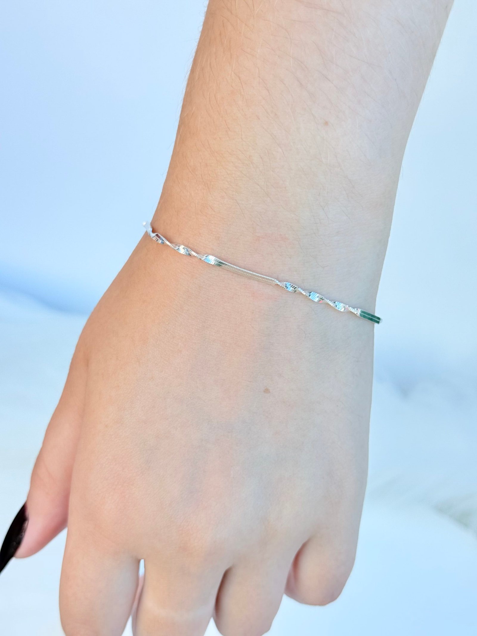 PULSEIRA EM PRATA 925 LAMINADA TORCIDA