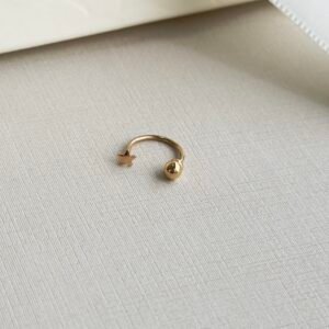 PIERCING EM OURO 18K FERRADURA ESFERA / ESTRELA